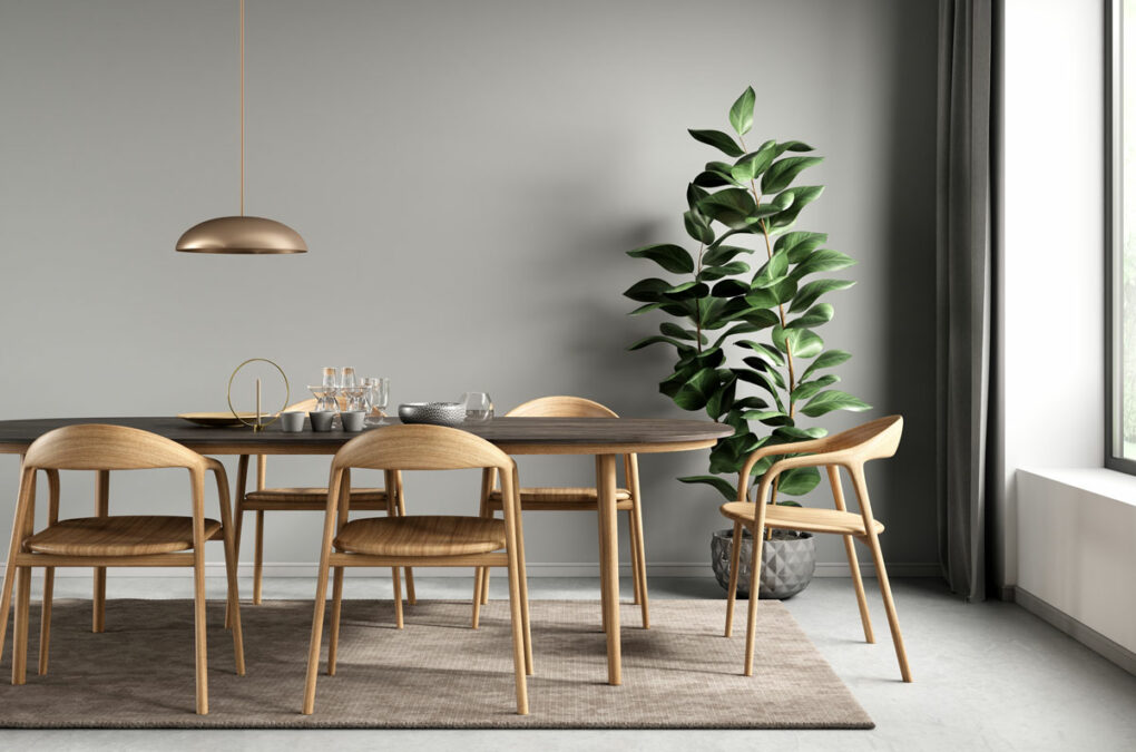Esszimmer mit braunem Tisch und Pflanze im Fenghshui Design