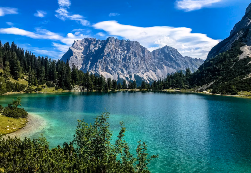 Glacial lake and mountains under blue sky